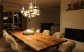 Dining room in dark natural oak with seating and panorama chimney
